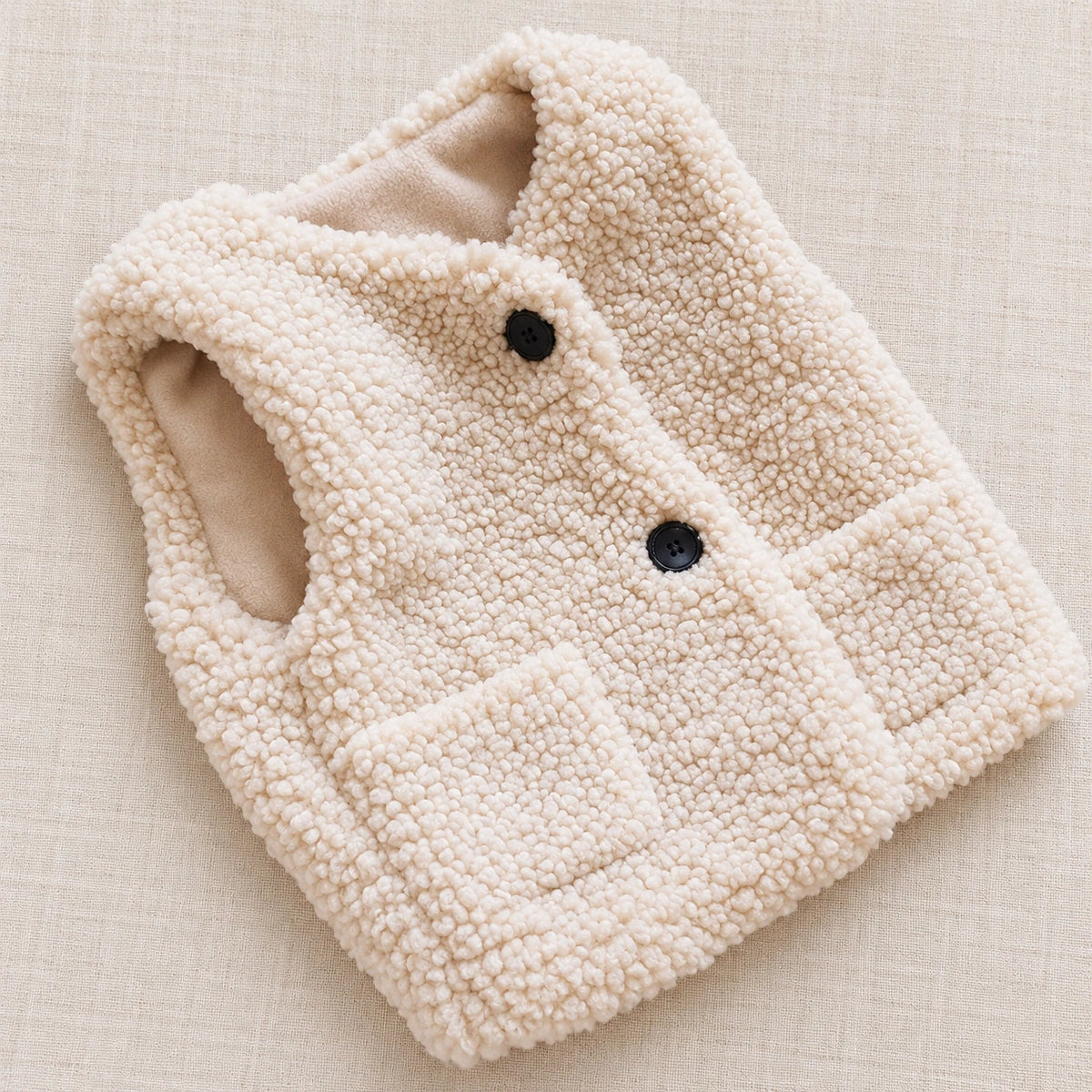 The Teddy Button Vest — Ivory — studio product photograph