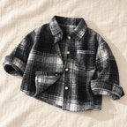 The Little Plaid Shirt Jacket — Black Check — studio product photograph
