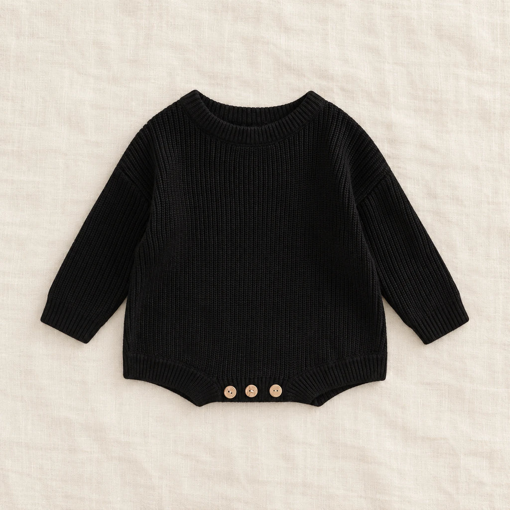 The Everyday Rib Knit Baby Bodysuit — Black — studio product photograph