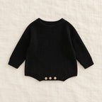 The Everyday Rib Knit Baby Bodysuit — Black — studio product photograph