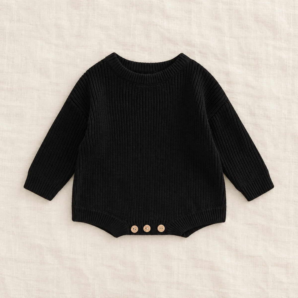 The Everyday Rib Knit Baby Bodysuit — Black — studio product photograph