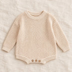 The Everyday Rib Knit Baby Bodysuit — Beige — studio product photograph