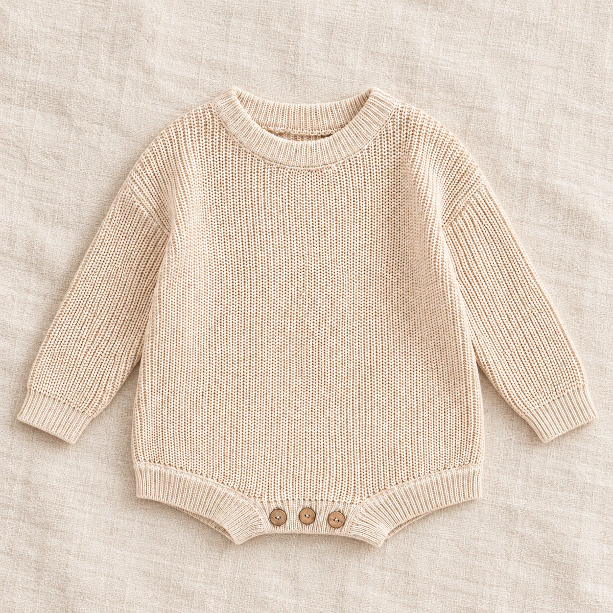 The Everyday Rib Knit Baby Bodysuit — Beige — studio product photograph