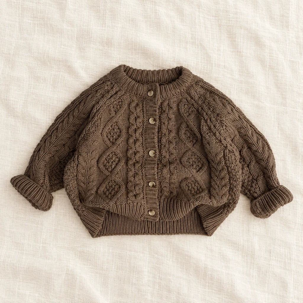 The Textured Cable Button Cardigan — Black — studio product photograph
