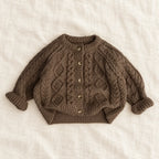 The Textured Cable Button Cardigan — Black — studio product photograph