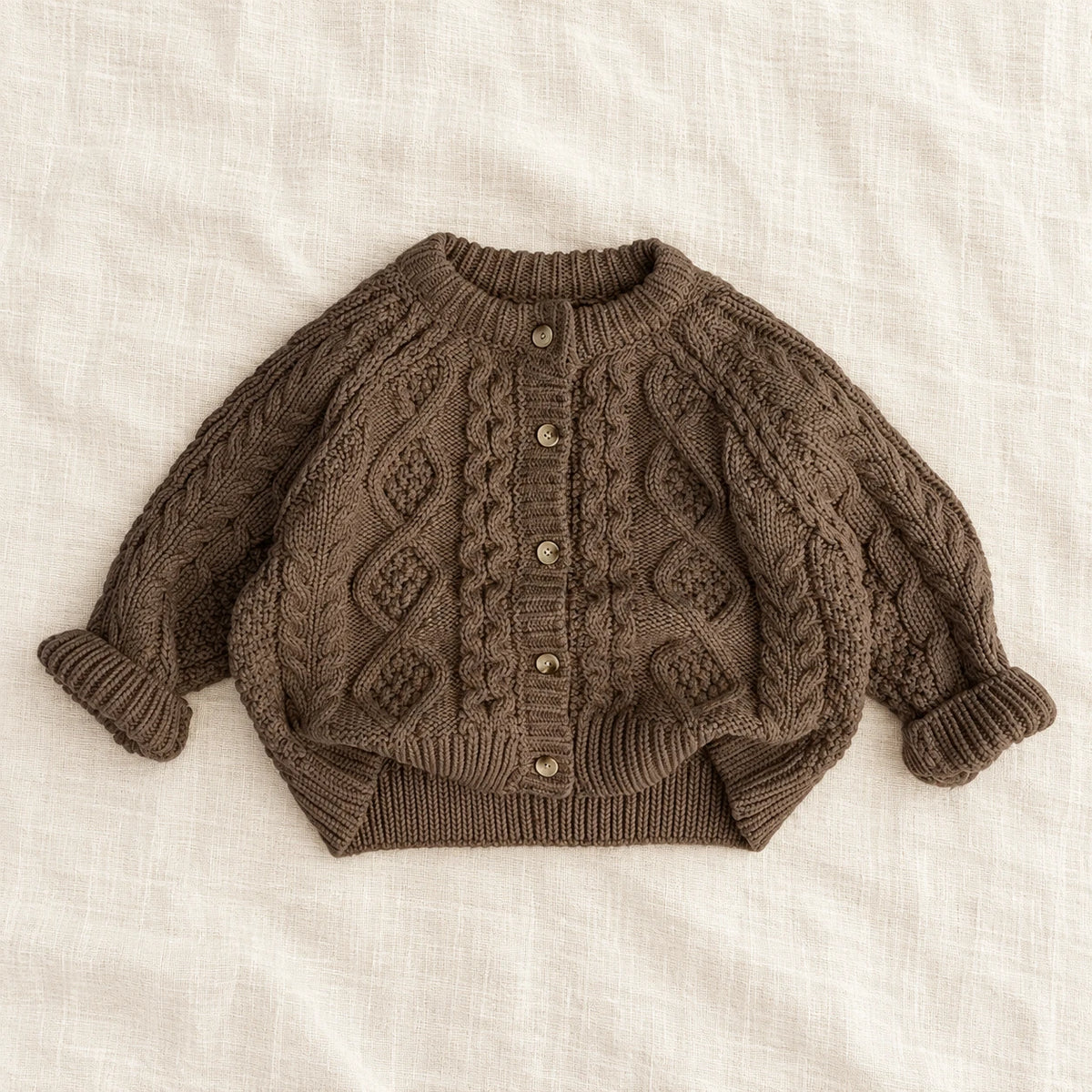 The Textured Cable Button Cardigan — Black — studio product photograph