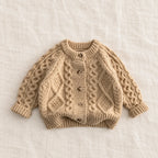 The Textured Cable Button Cardigan — Beige — studio product photograph