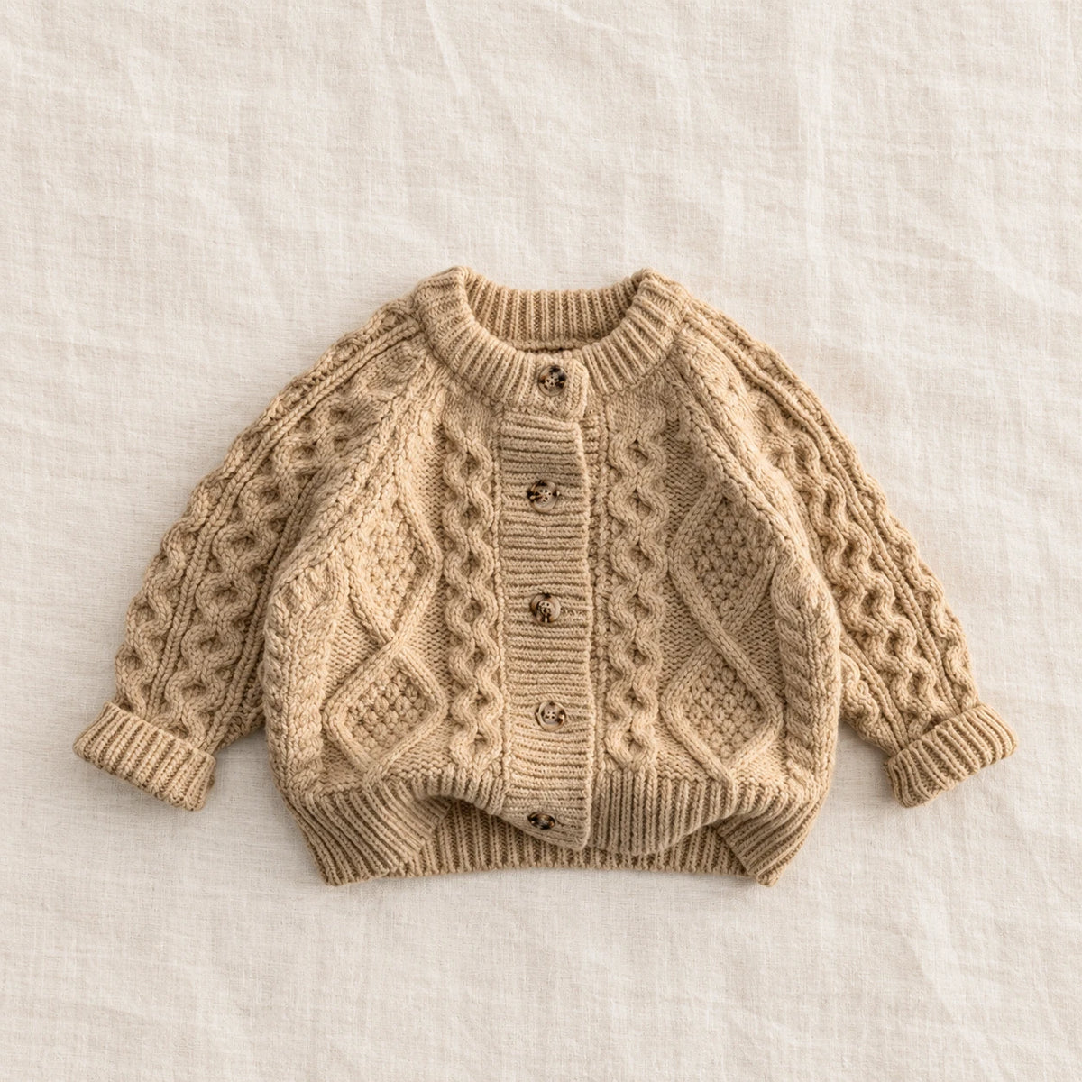 The Textured Cable Button Cardigan — Beige — studio product photograph