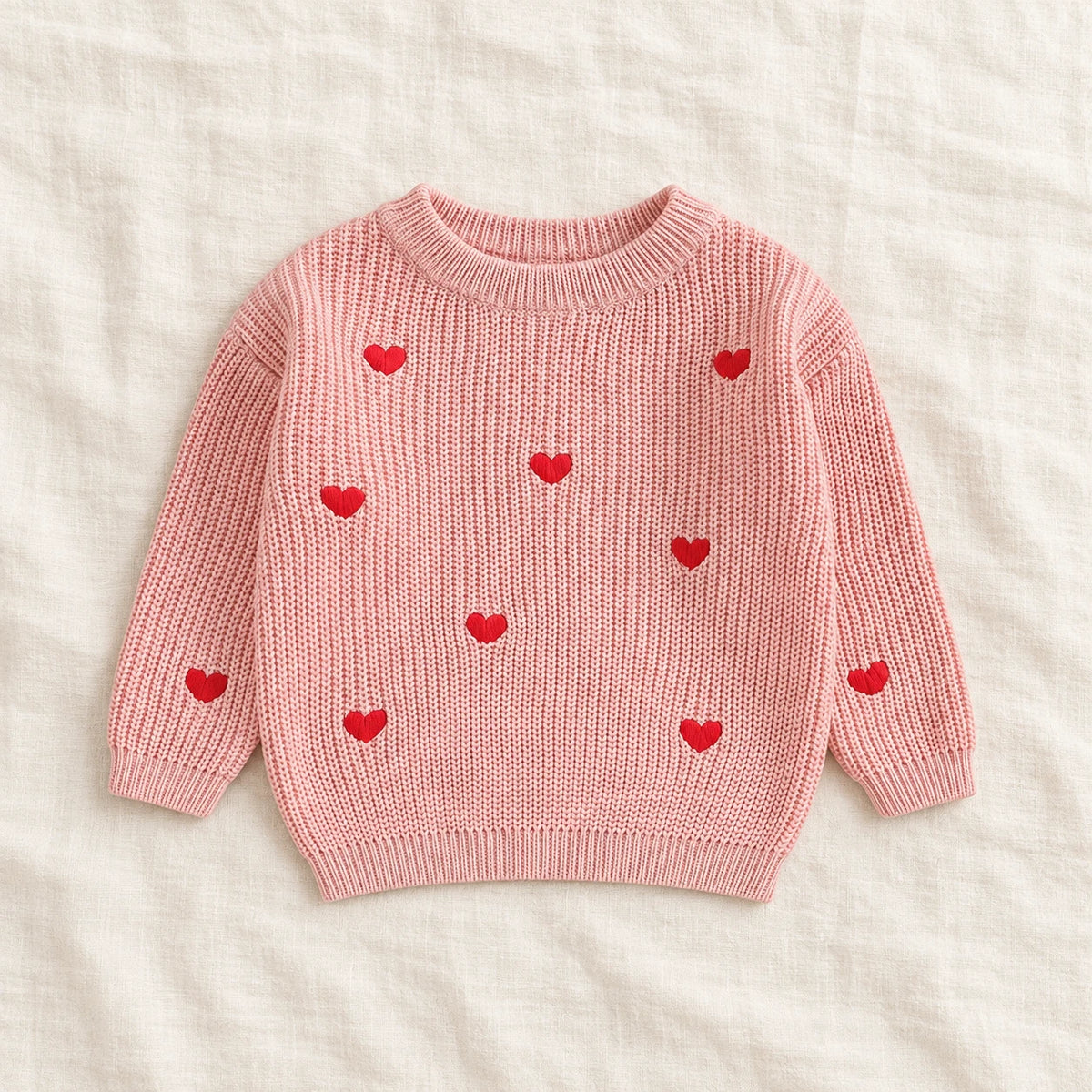 The Little Heart Knit Sweater — Pink — studio product photograph