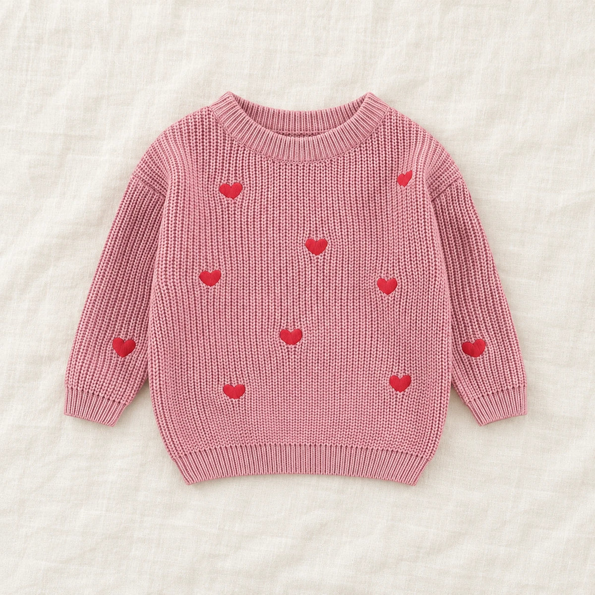 The Little Heart Knit Sweater — Rose Pink — studio product photograph