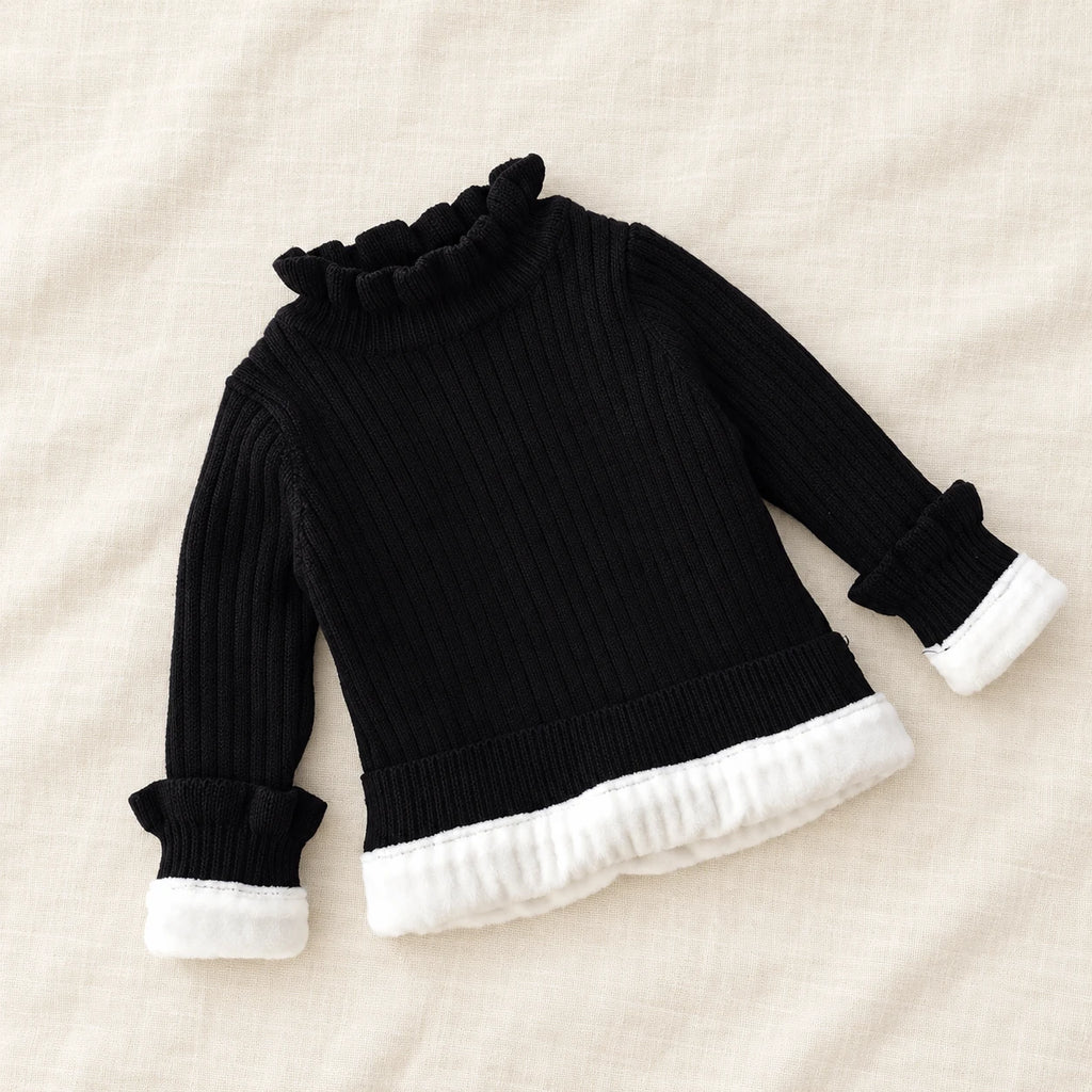 The Fleece-Lined Ruffle Knit Sweater — Black — studio product photograph