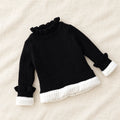 The Fleece-Lined Ruffle Knit Sweater — Black — studio product photograph