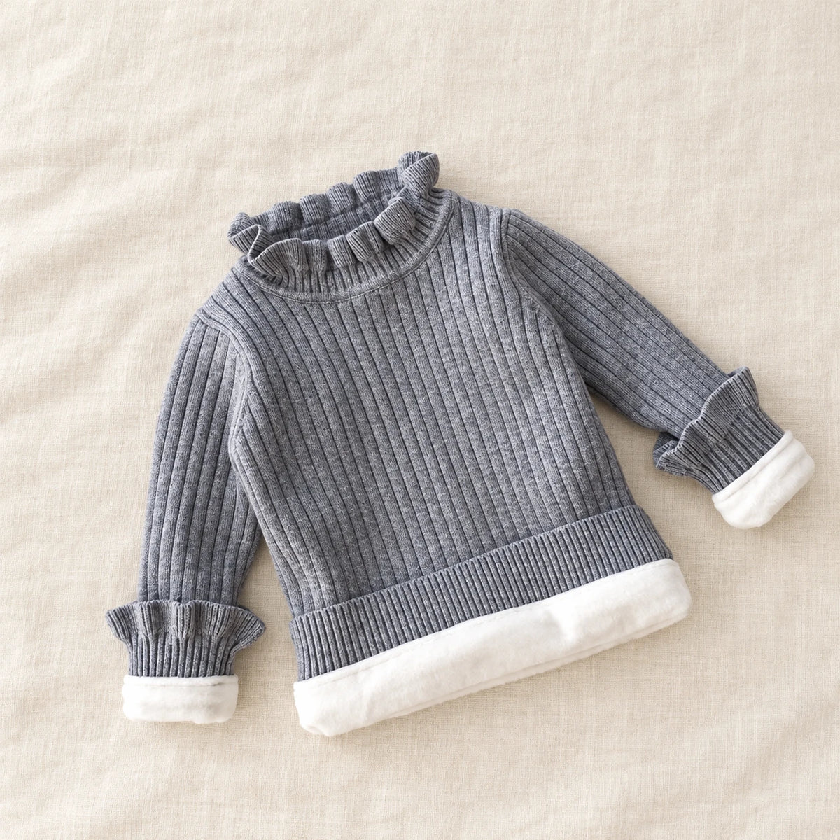 The Fleece-Lined Ruffle Knit Sweater — Gray — studio product photograph
