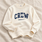 The Everyday Kids Sweatshirt — Ivory Crew Print — studio product photograph