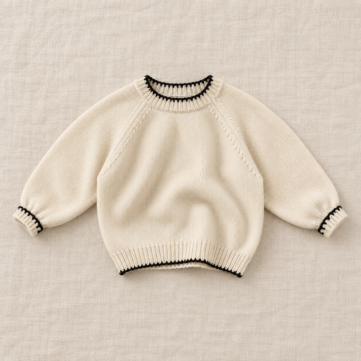 Cream contrast-trim knit sweater, front view