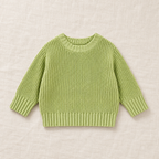 The Everyday Chunky Knit Sweater in Light Green, laid flat on ivory linen