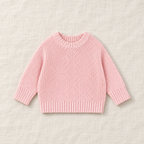 The Everyday Chunky Knit Sweater in Pink, laid flat on ivory linen