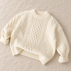 The Fleece-Lined Cable Knit Sweater on ivory linen