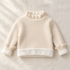 The Fleece-Lined Ruffle Knit Sweater on ivory linen