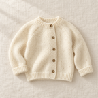 The Fuzzy Round-Neck Cardigan on ivory linen