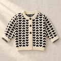 The Heart Jacquard Knit Cardigan on ivory linen