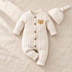 The Ivory Bear Romper & Hat Set on ivory linen