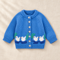 The Little Duck Knit Cardigan on ivory linen