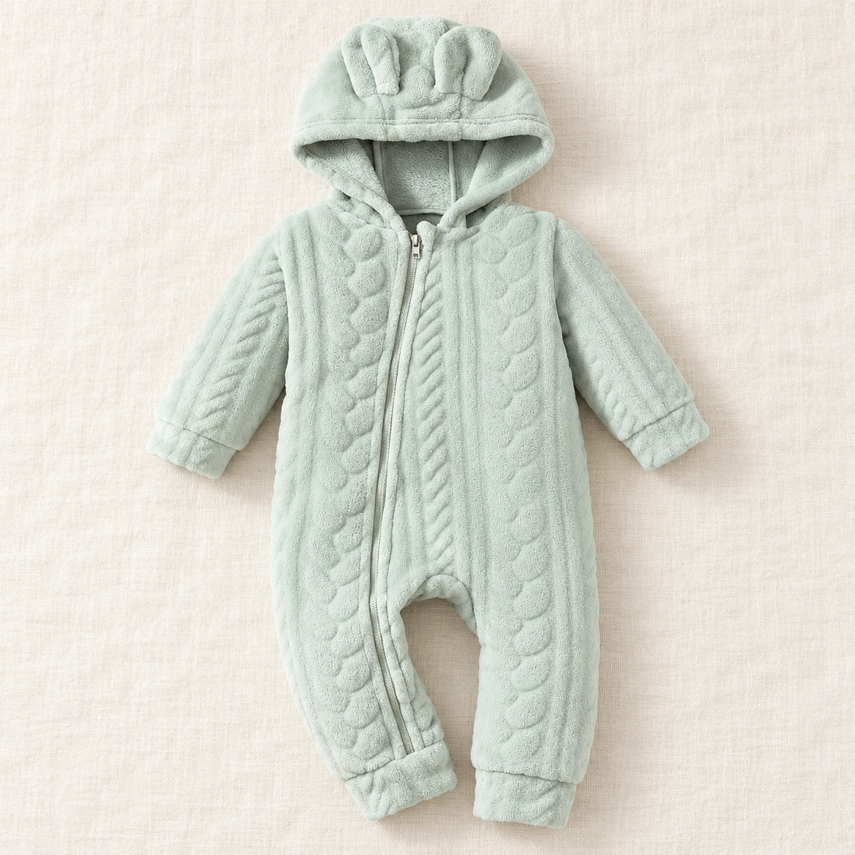 Mint plush hooded romper with bunny ears, textured cable pattern and front zip