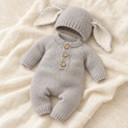 The Bunny Knit Romper & Hat Set studio photograph on ivory linen
