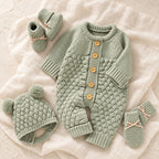 The Newborn Knit Wardrobe, coordinated baby knit outfit on ivory linen