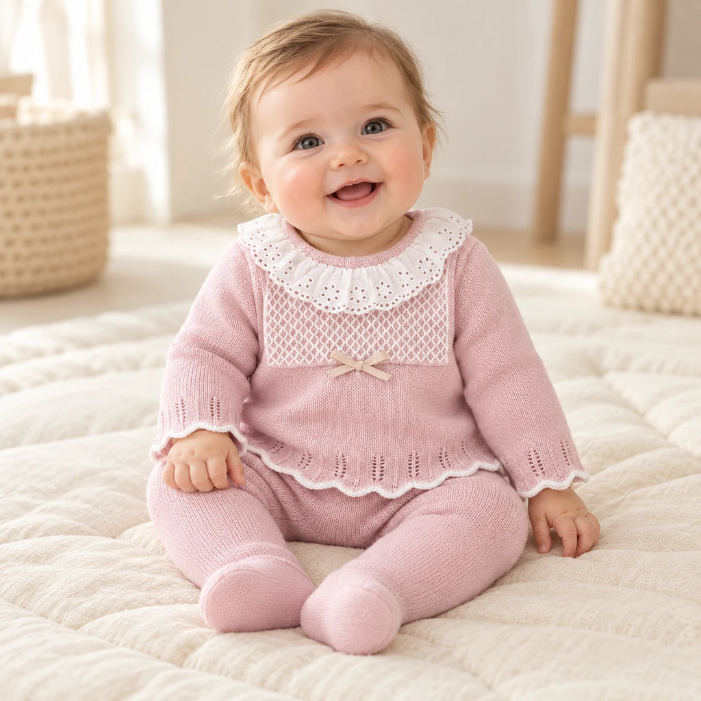 Baby wearing The Everyday Knit Two-Piece Set in a warm nursery