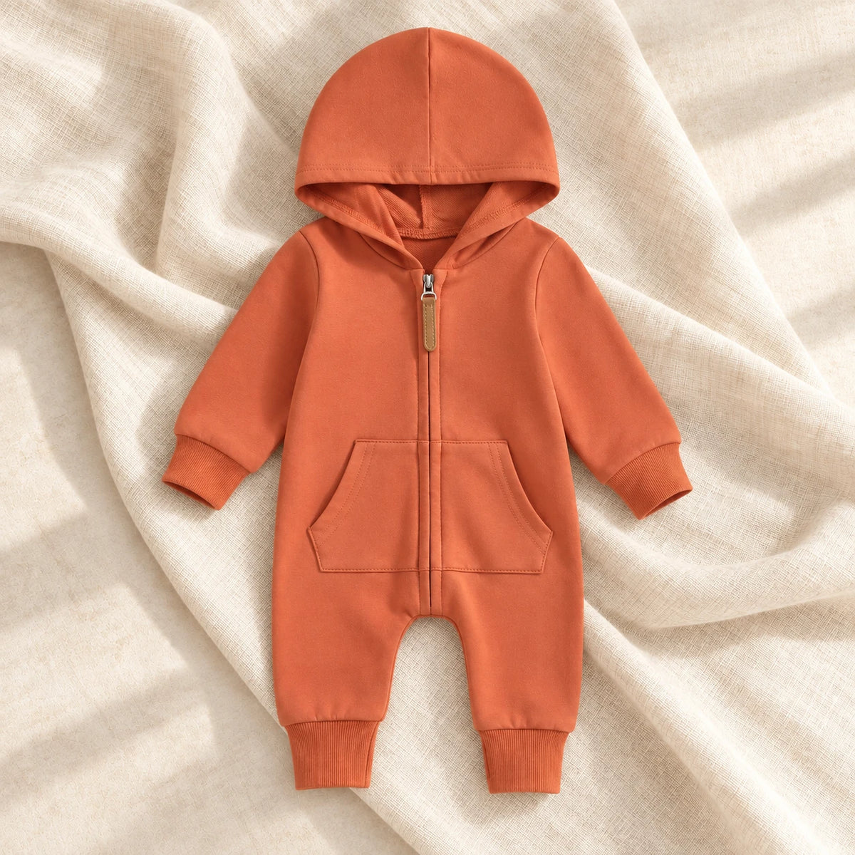 The Hooded Zip Baby Romper — Style 02 studio photo