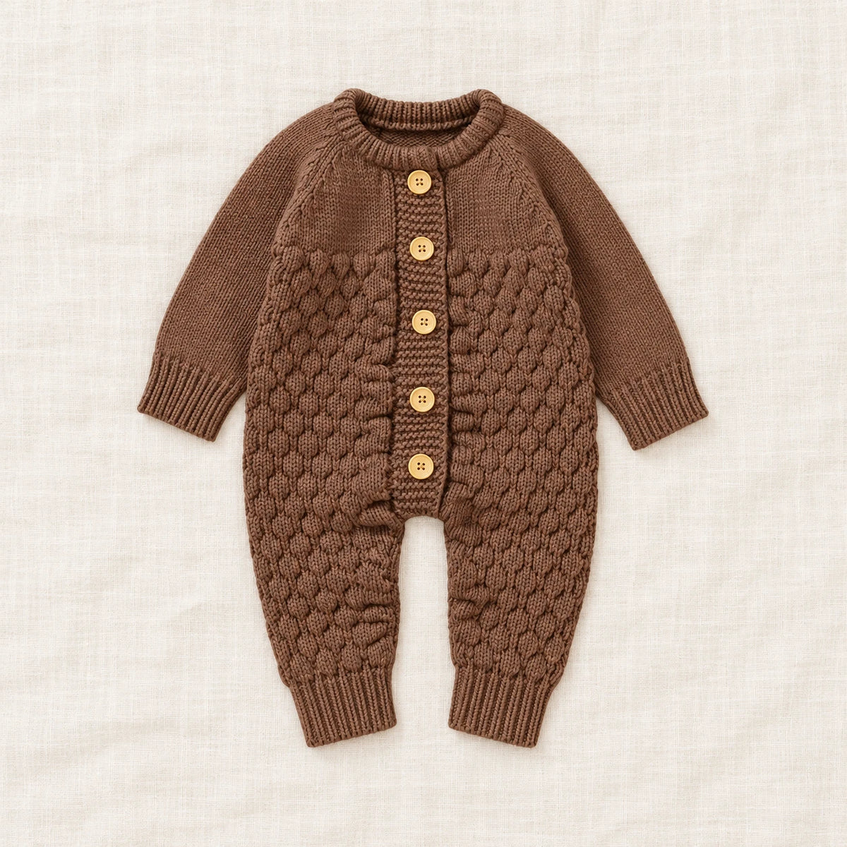 The Newborn Knit Wardrobe — Cocoa, Romper in boutique studio photograph