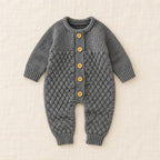 The Newborn Knit Wardrobe — Charcoal, Romper in boutique studio photograph