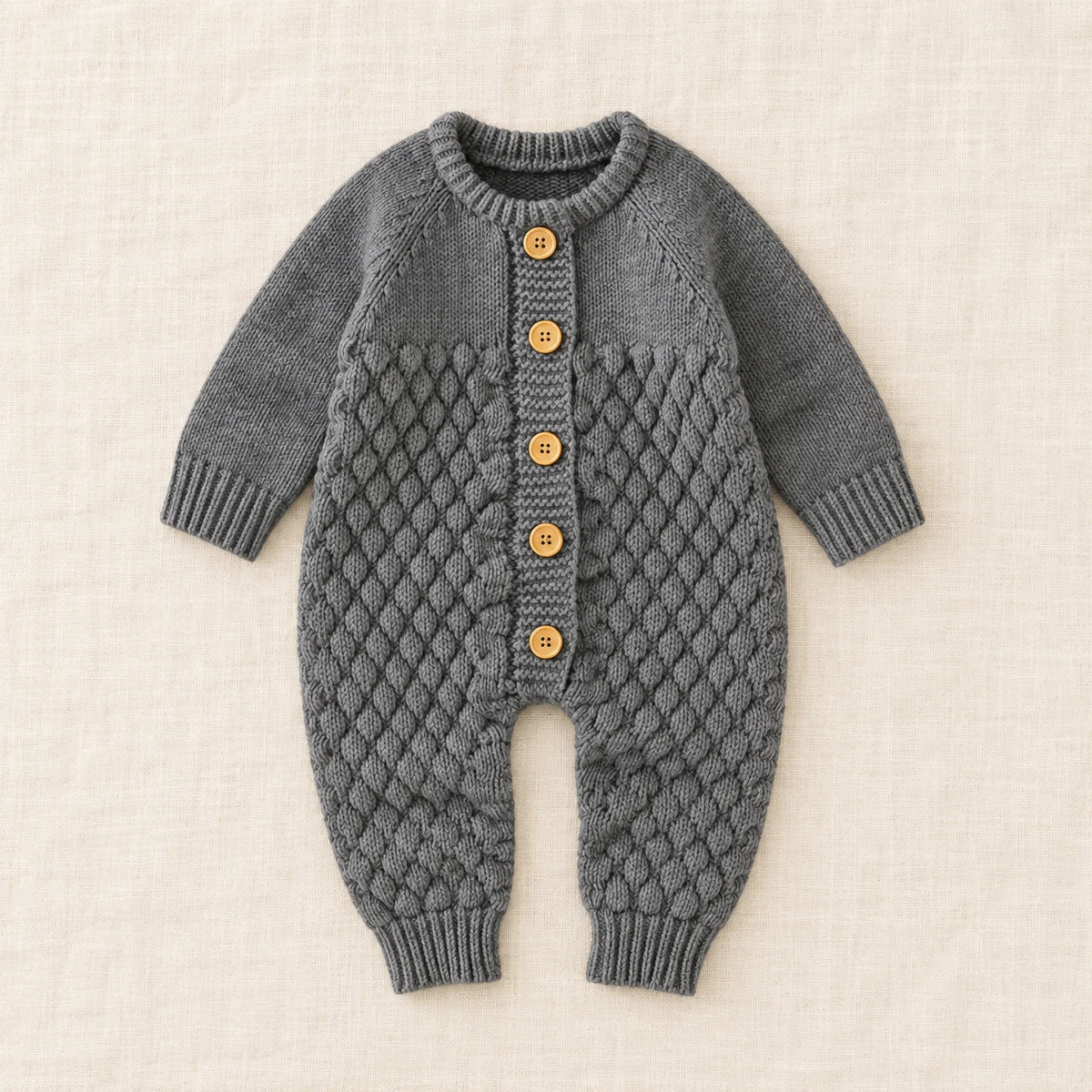 The Newborn Knit Wardrobe — Charcoal, Romper in boutique studio photograph