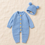 The Newborn Knit Wardrobe — Blue, Romper & Hat in boutique studio photograph