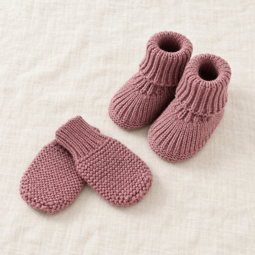 The Newborn Knit Wardrobe — Mauve, Booties & Mittens in boutique studio photograph
