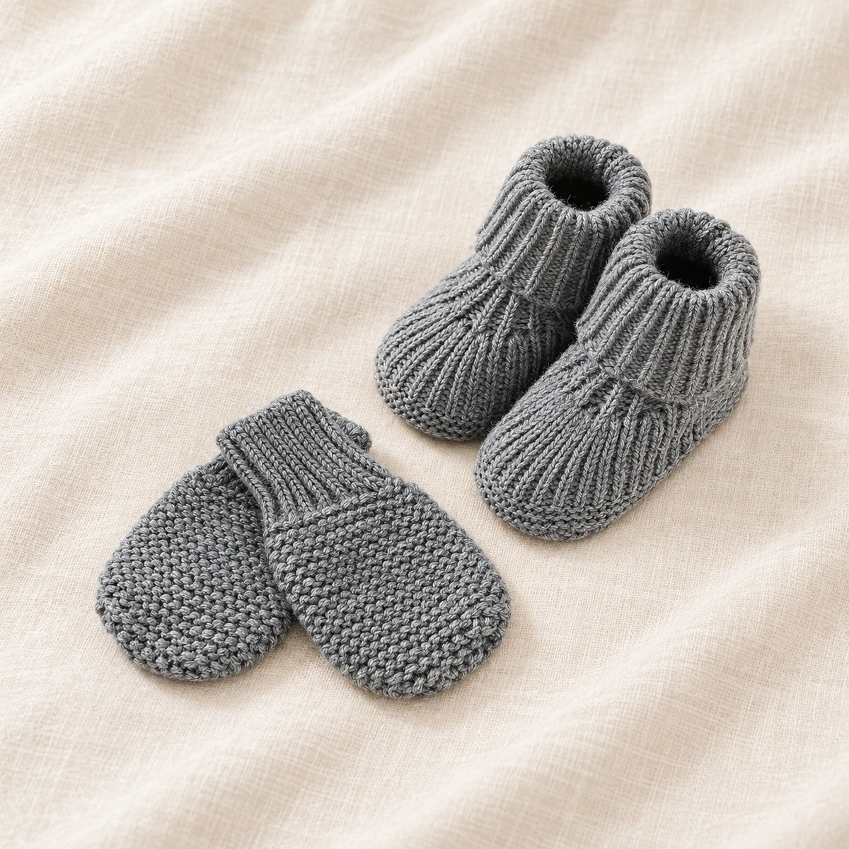 The Newborn Knit Wardrobe — Slate, Booties & Mittens in boutique studio photograph