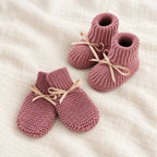 The Newborn Knit Wardrobe — Mauve Ribbon, Booties & Mittens in boutique studio photograph