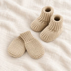 The Newborn Knit Wardrobe — sand plain booties and mittens on ivory linen