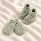 The Newborn Knit Wardrobe — sage plain booties and mittens on ivory linen