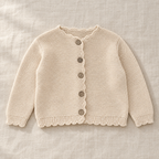 The Scallop-Edge Knit Cardigan on ivory linen