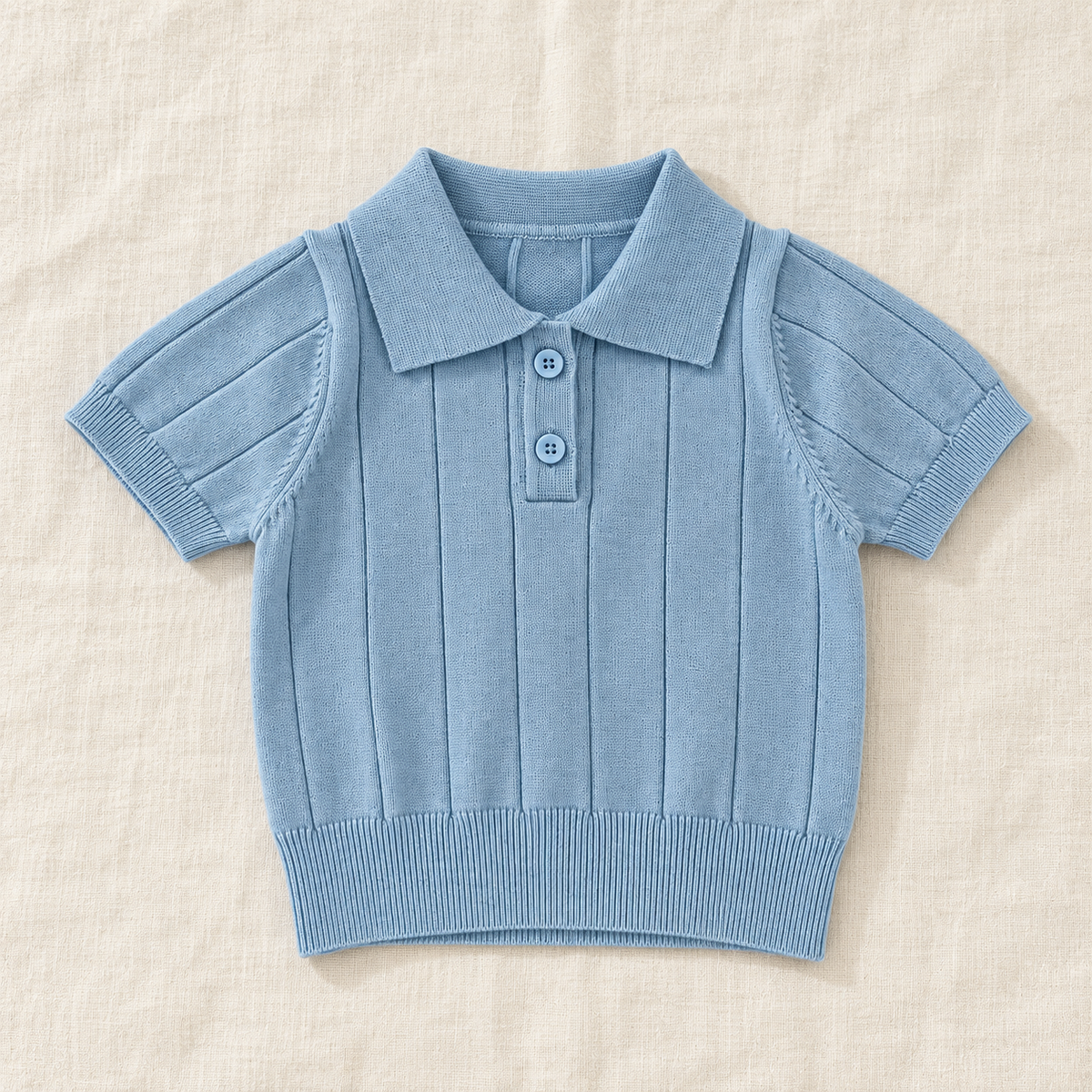 The Knit Polo & Shorts Separates — Blue Polo, laid flat on ivory linen