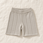 The Knit Polo & Shorts Separates — Beige Shorts, laid flat on ivory linen