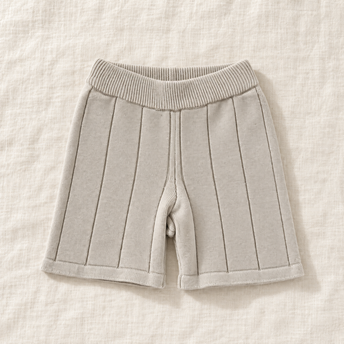The Knit Polo & Shorts Separates — Beige Shorts, laid flat on ivory linen