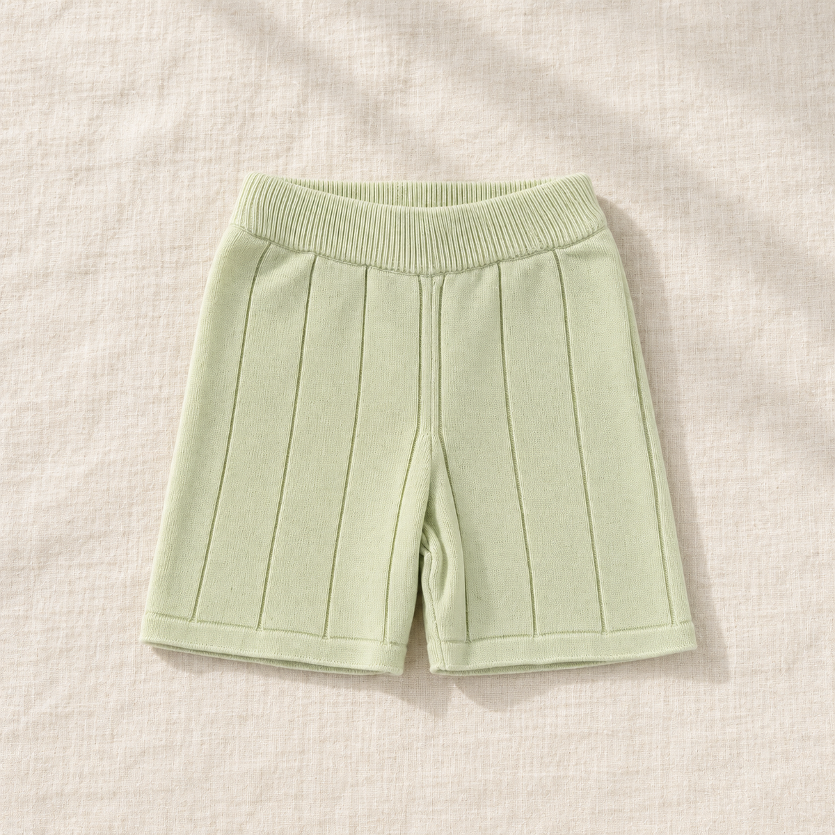 The Knit Polo & Shorts Separates — Light Green Shorts, laid flat on ivory linen