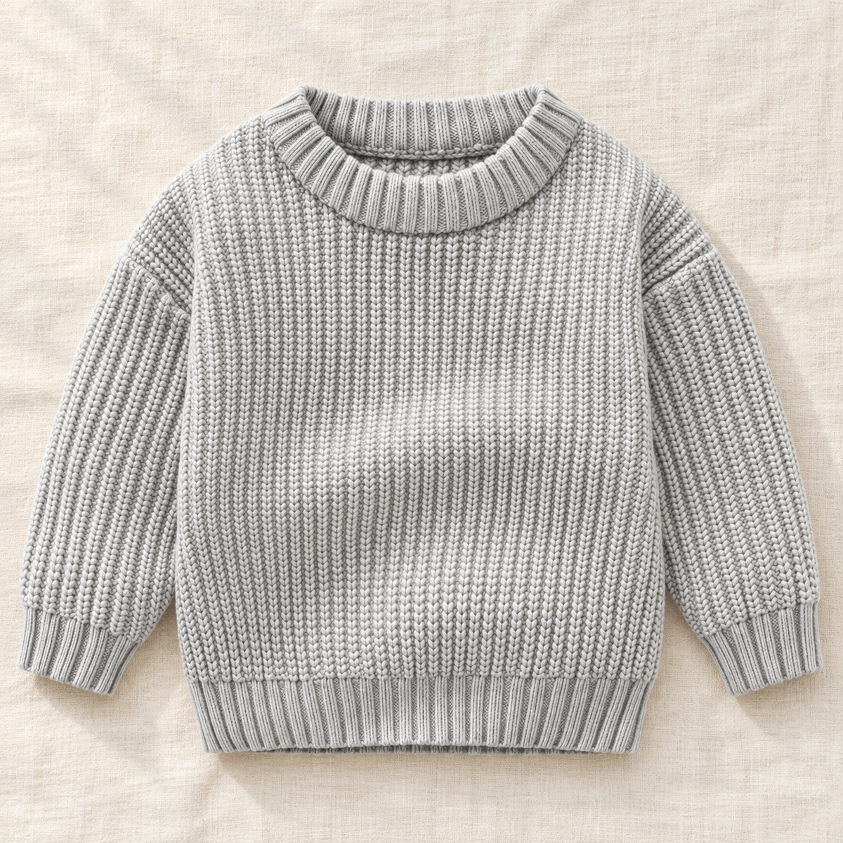 The Everyday Textured Knit Sweater — Gray · Classic Knit, laid flat on ivory linen