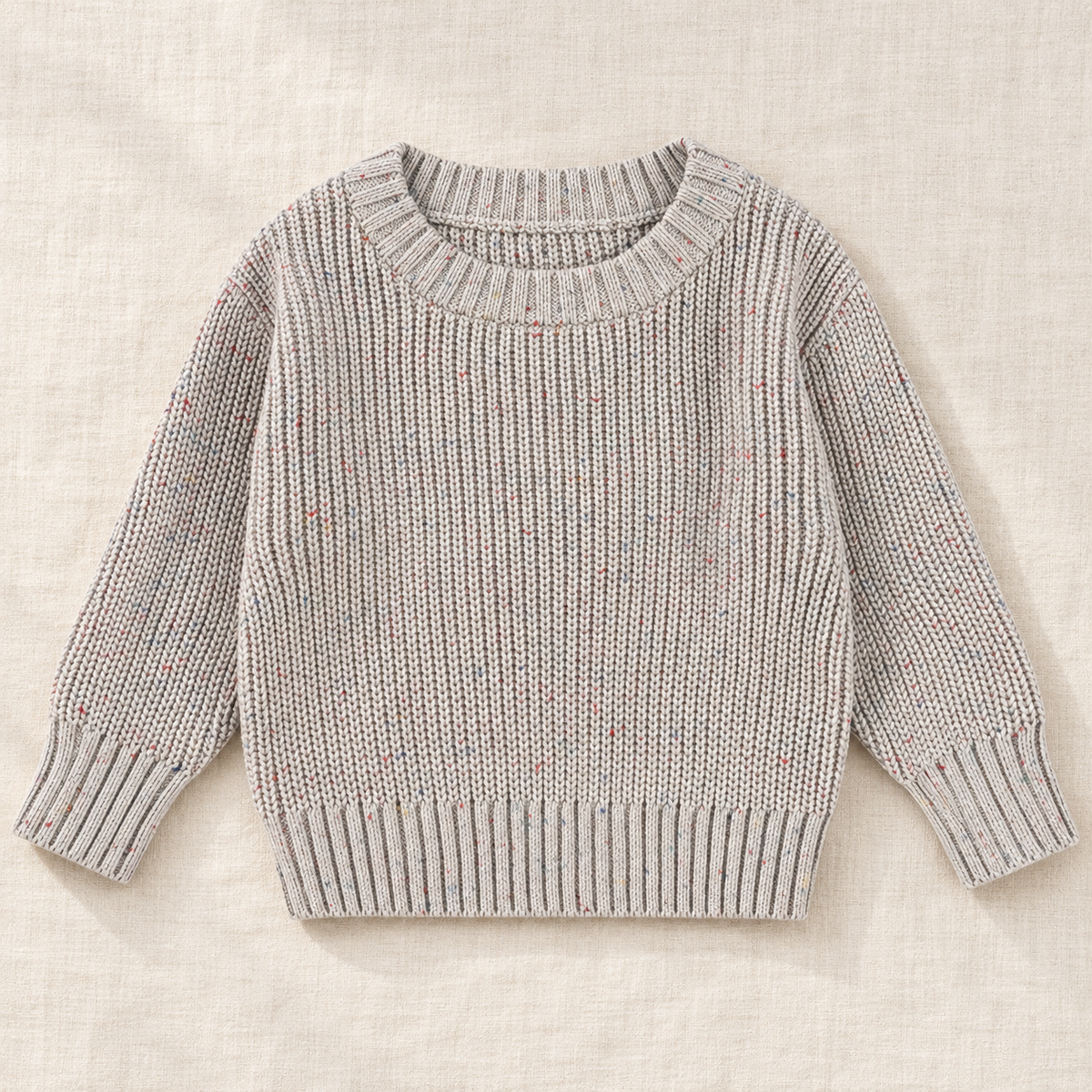 The Everyday Textured Knit Sweater — Gray · Flecked Knit, laid flat on ivory linen