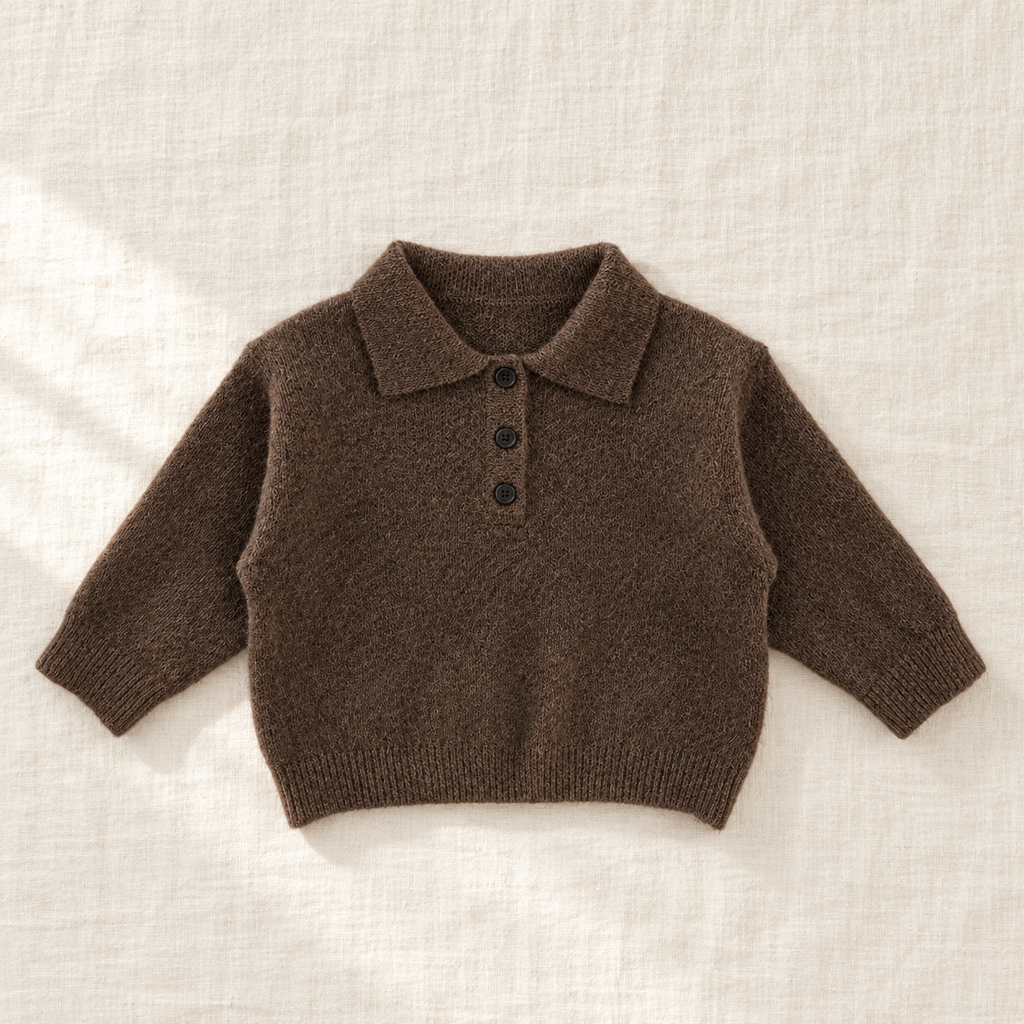 The Long-Sleeve Knit Polo — Coffee, laid flat on ivory linen