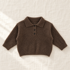 The Long-Sleeve Knit Polo — Coffee, laid flat on ivory linen